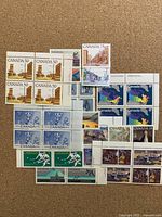 All stamp blocks and pairs laid out on corkboard