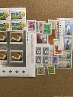 Group shot showing Science & Technology block, The Young Reader block, assorted singles and Astronomy stamps