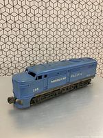 Three-quarter front view of blue Lionel Missouri Pacific 205 locomotive showing overall condition