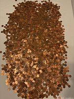 Full spread of pennies on surface