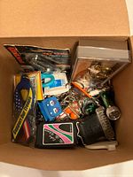 Top-down view of box filled with assorted key chains