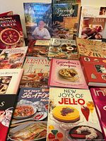 All books and binder laid out on table, titles visible