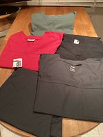 overview of five scrub pieces laid out on table