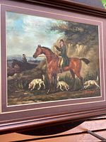 Full view of framed hunting scene painting