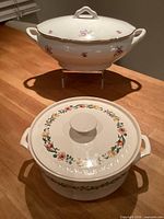 Both lidded dishes front view on table