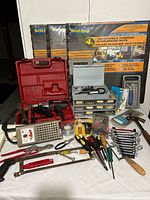 Full lot overview with drill, Dremel kit, organizer, mats, battery tester and hand tools