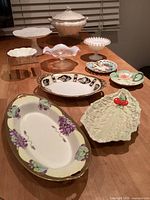 Group shot of all ten serving pieces displayed on table