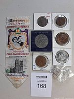 Overall view of all coins, ribbon and lot number