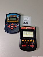 Front view of both handheld games showing screens and controls