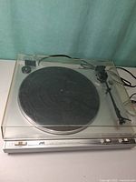 Overall view of JVC L-A10 turntable with dust cover closed
