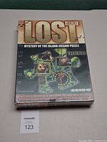Front of sealed LOST puzzle box showing title, series number and piece count