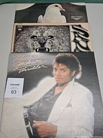 Front covers of Thriller, Santana debut, Santana Greatest Hits