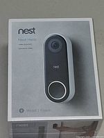 Front of sealed Nest Hello wired video doorbell retail box