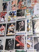 Overview of binder page layout with numerous hockey cards
