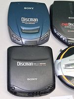 Four Sony Discman units grouped