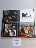 All four Beatles CD fronts displayed