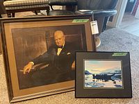 Both framed prints side by side on carpet