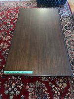 Top view of the wood coffee table on rug