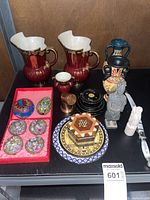 Entire lot showing jugs, figurines, cloisonné set, plates and other items