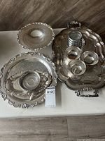 Group shot of all electroplated pieces and glass coasters on table