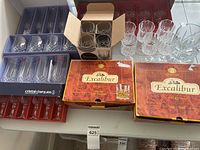 Assorted boxed glassware sets including Excalibur hi-balls, Cristal d’Arques flutes, loose DOF glasses and more