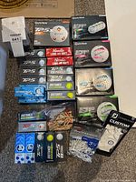 Wide view of all golf ball boxes, tees and accessories