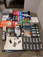 Overall lot showing golf balls, glove, towel, tees and accessories