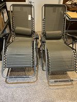 Both matching zero gravity chairs upright front view
