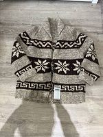 Full view of sweater front laid flat