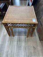 Full view of square rattan side table showing top and sides