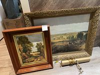 Overall lot view showing both framed prints and picture light