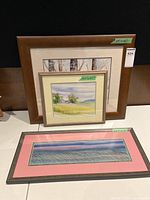 Three framed watercolours grouped
