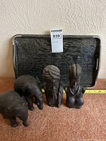 Overall lot showing tray, two elephant figurines, two busts