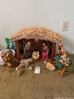 Full nativity set with stable, human and animal figures