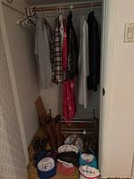 Overall closet view showing coats, boots, hats, shoe rack