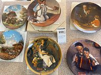 Overview of six collector plates showing designs and MaxSold lot tag