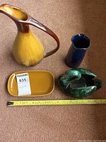 Group shot showing all four ceramic items with measuring tape for scale