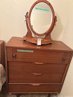 Front view of dresser with mirror placed on top