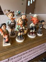 All seven Goebel figurines front view