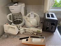 Group shot of all six kitchen appliances on countertop