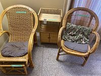 Two rattan chairs, footrest, and stand
