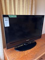 Front view of Samsung TV displaying screen, bezel, and stand