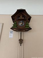 Front view of chalet-style cuckoo clock on wall