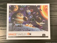 Front of shrink-wrapped puzzle box showing artwork, piece count and dimensions