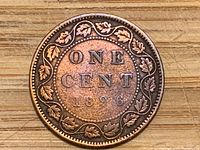 Reverse of 1896 Canadian one-cent coin showing denomination, date and maple leaf wreath
