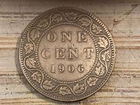 Reverse of 1906 Canada One Cent coin showing denomination and date