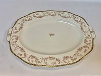 Top view of Alfred Meakin Harmony Rose oval platter showing floral rim and gold trim