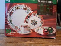 Front of box showing holiday dinnerware set graphics and branding