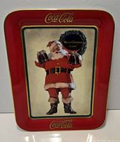 Front view of red-border Coca-Cola Christmas porcelain plate