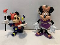 Front view of both keychain figurines showing size and detail